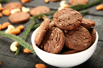 Homemade fresh baked cashew nuts, almonds cookies on a rustic kitchen table background. 