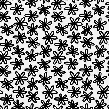 Abstract hand drawn seamless pattern with flower shape elements. Black and white texture.