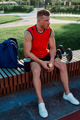 sporty man sitting on bench fitness workout lifestyle