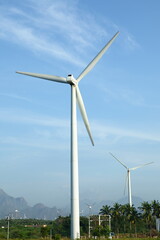 Wind mills on a blue-sky background.