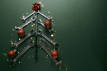 Christmas tree made of various tools on a green background. Happy christmas and happy new year. 