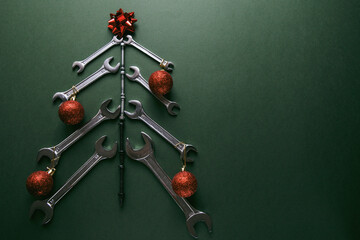 Christmas tree made of various tools on a green background. Happy christmas and happy new year. 
