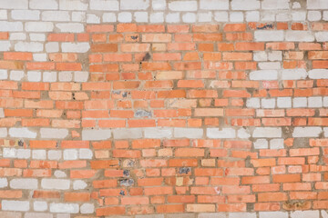 Old brick wall with red brown and white stone surface texture background