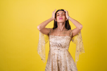 Young woman in new year's eve evening shiny sparkling beige dress celebrates the holidays, bright pink lipstick lip gloss