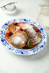 Traditional homemade pancakes with raspberry