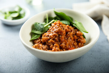 Homemade minced beef ragout with spinach