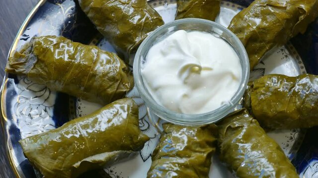 Delicious dolma with the cream sauce on a asian plate