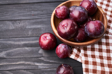 plums fruits natural products on a wooden table top view
