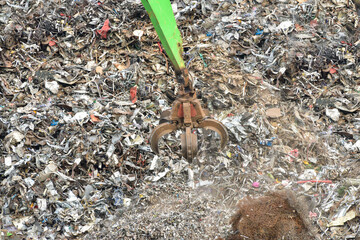 Machine operated grabbing arm, loading scrap metal onto a ship in the harbour of Newhaven, UK. (Release)
