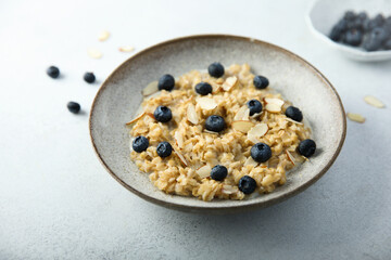 Homemade oatmeal porridge with blueberry and almond flakes