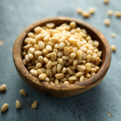 Organic pine nuts in a wooden bowl