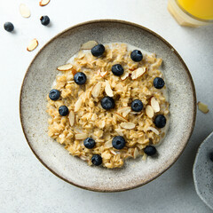 Homemade oatmeal porridge with blueberry and almond flakes
