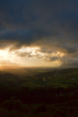 Fototapeta premium Moody morning clouds with sunlight coming through