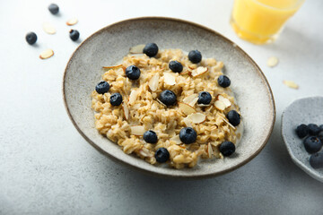 Homemade oatmeal porridge with blueberry and almond flakes