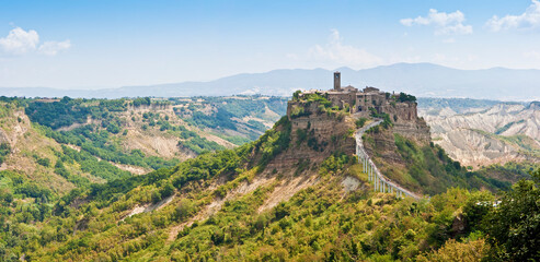 Panoramic view of the famouse medieval citadel of Civita town with the elevated walkway (Italy - Lazio - Viterbo - Bagnoregio) - obrazy, fototapety, plakaty