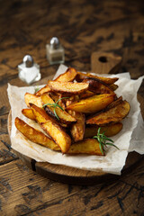 Homemade roasted potato wedges with rosemary