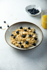 Homemade oatmeal porridge with blueberry and almond flakes