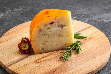 Hard cheese with dry tomato