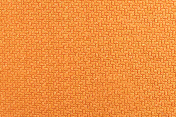 Orange geometric texture embossed on hard cardboard