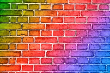 Colorful brick wall background with multi colored rainbow effect
