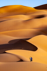 Fototapeta na wymiar lonley people in the desert of sahara