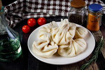 Georgian big khinkali on a white plate