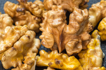 Full frame of shelled organic walnuts as background