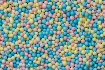 Brightly colored polystyrene beads texture as full-frame background