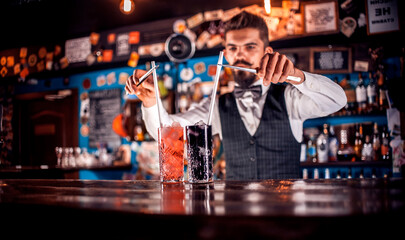 Bartender concocts a cocktail at the taproom
