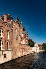 Fototapeta premium Medieval town with old buildings and stones in late autumn in Belgium, Bruges, Brugge