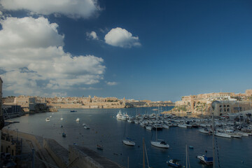 Fototapeta premium Bay with marina and boats during clear day on island of Malta
