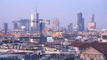 Europe , Italy , Milan December 2021 - 
aerial view of the city skyline in Gae Aulenti Garibaldi  at sunset from Duomo Terrace 