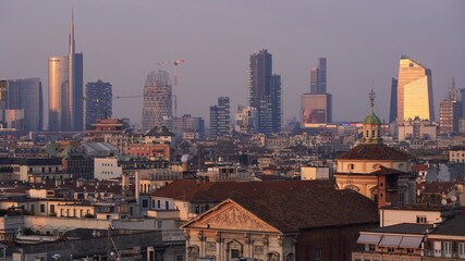 Europe , Italy , Milan December 2021 - 
aerial view of the city skyline in Gae Aulenti Garibaldi  at sunset from Duomo Terrace 