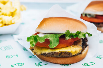 Delicious fresh handmade burger with cheddar cheese and tasty burger sauce.