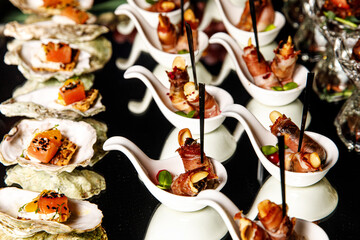 Catering services with snacks on guests table in the restaurant at the event party