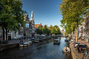 Street view with buildings and during day and canal in Amsterdam, Netherlands