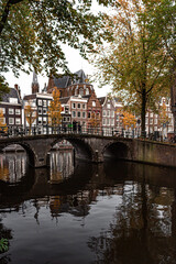 Obraz premium Street view with buildings and during day and canal in Amsterdam, Netherlands