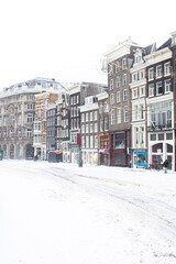 Fototapeta premium Snow covered streets with cold weather in Amsterdam, Netherlands