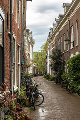 Fototapeta na wymiar Street of old town with old buildings in Haarlem, Netherlands