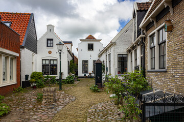Fototapeta na wymiar Port town with old buildings in Texel, Netherlands