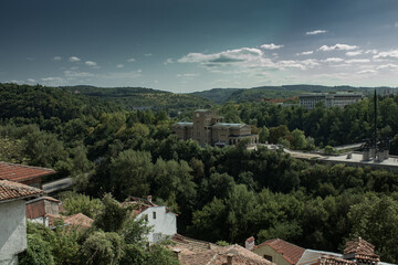 Fototapeta na wymiar City in mountain area with greenery in summer day in Veliko Tarnovo, Bulgaria