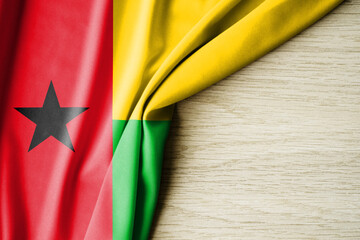 Guinea Bissau flag. Fabric pattern flag of Guinea Bissau. 3d illustration. with back space for text.