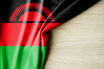 Malawi flag. Fabric pattern flag of Malawi. 3d illustration. with back space for text.