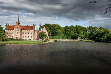 Fototapeta premium Castle estate during summer day in Egeskov Slot, Denmark
