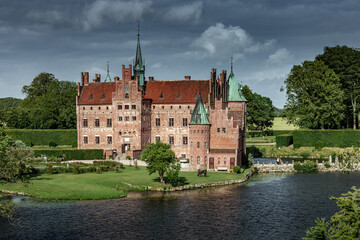 Fototapeta premium Castle estate during summer day in Egeskov Slot, Denmark