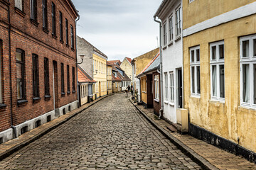 Fototapeta na wymiar Beautiful view from the street in old quaint town in Faaborg, Denmark