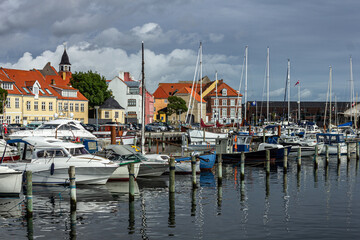 Fototapeta na wymiar Beautiful view of old port town with charming buildings in Svendborg, Denmark