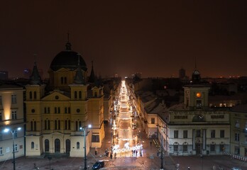 Aerial night winter view above Piotrkowska street in Łódź, Poland © uslatar