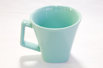 Ocean green coffee cup with white background.
