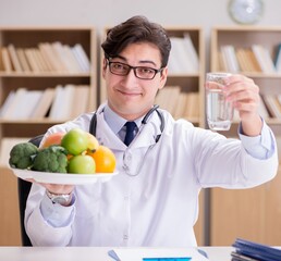 Doctor in dieting concept with fruits and vegetables